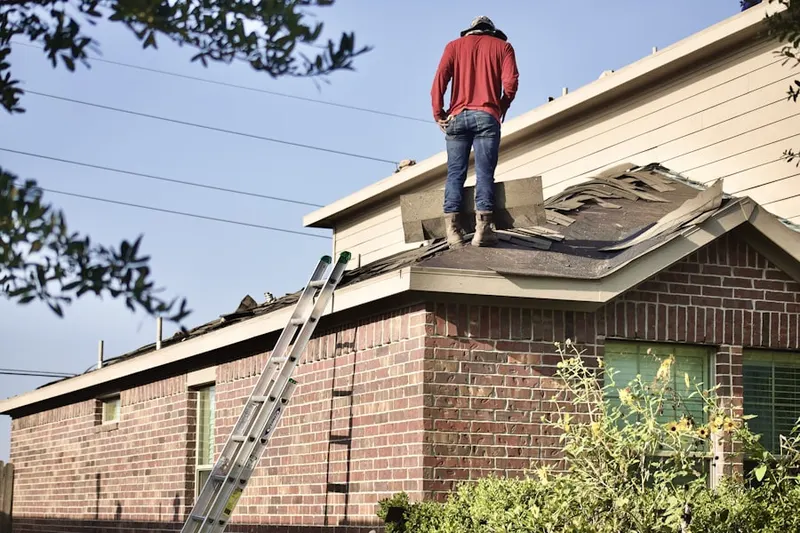 Professional roofer working on a residential roof in Lonetown